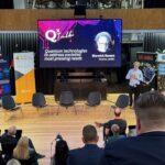 Warwick on stage at Qx conference